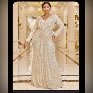 Beautiful long sleeve sequin gown in gold